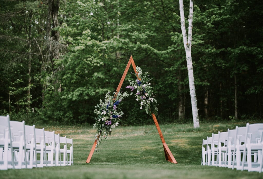 Wedding-Ceremony-Arch-Empty-Chairs